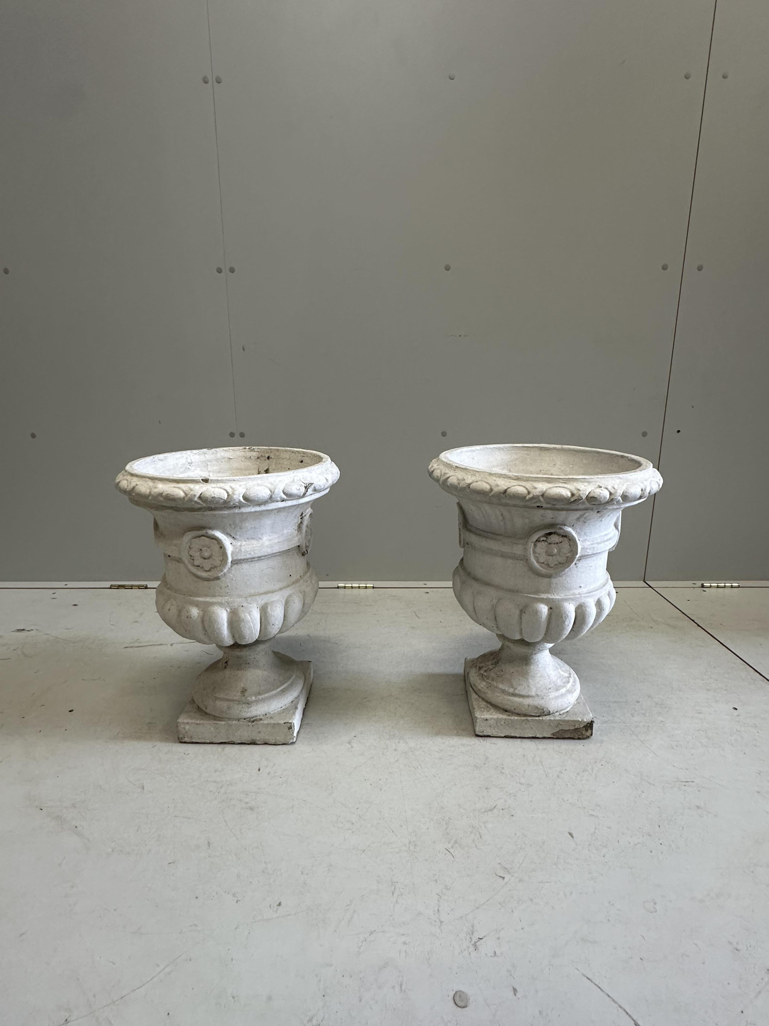 A pair of painted reconstituted stone campana garden urns, diameter 36cm, height 49cm. Condition - poor to fair